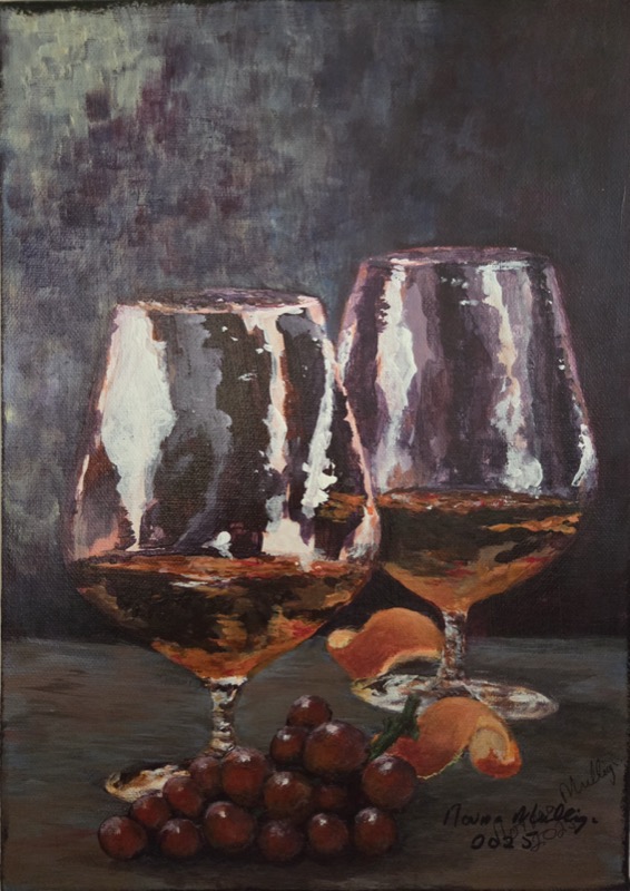 Two brandy glasses catching the light in a darkened room, with red grapes and apricots on the table before them